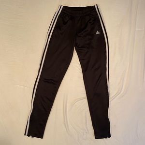 Black women Adidas joggers.